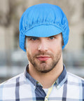 Man wearing lightweight blue bouffant cap, showcasing Five Piece Anti Static Work Caps Blue Bouffant Hair Nets Lightweight Mesh Headcaps Super Breathable All Day Comfy No Sweat Feel Solid Build Industrial Grade Protection For Cleanroom Pharma Labs.