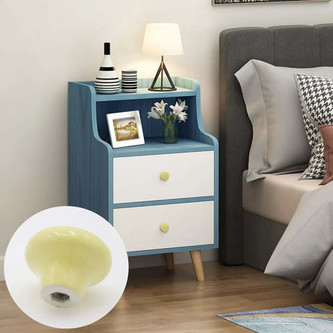 Light Yellow Ceramic Cabinet Knobs And 32 Millimeter Round Drawer Pulls Featuring A Knockout Matte Finish And Dang Easy Hardware Setup For Kitchen Cupboards And Vanities Snagged In A Ten Pack Bundle on a nightstand.