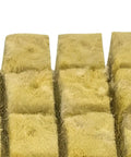 Close-up of rockwool cubes, texture details, for Hydroponic Net Pot Kit For Veggies And Fruits Tough Mesh Cups With Even Moisture Easy Setup.