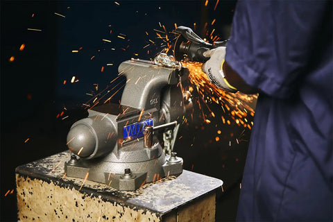 Beefy Pro Grade Bench Vise 4-1/2 Inch Jaw, 3-1/2 Inch Opening, 3-1/4 Inch Throat, 60,000 PSI Ductile Iron Body With Enclosed Lubrication, Heavy-Duty Anvil For Rugged Metalworking And Smooth, Long Lasting Operation used for grinding metal on a workbench