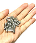 Top Grade 25 Pack Of 6Mm X 12Mm 304 Stainless Steel Dowel Pins And Precision Metal Shelf Pegs in a hand.