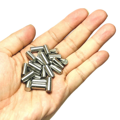 Top Grade 25 Pack Of 6Mm X 12Mm 304 Stainless Steel Dowel Pins And Precision Metal Shelf Pegs in a hand.