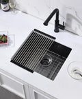 Top view of undermount kitchen bar sink 18 x 16 x 9 inches black stainless steel with rolled mat and grid in modern kitchen setup.