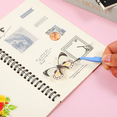 Two Piece Precision Tweezers Set In Blue With Straight And Curved Tips For Dope Fine Detail Work In Crafting Scrapbooking Stickers Lashes And Electronics Durable Stainless Steel Tweezers For Easy Precise Handling. Blue curved-tip tweezer placing a sticker in a scrapbook