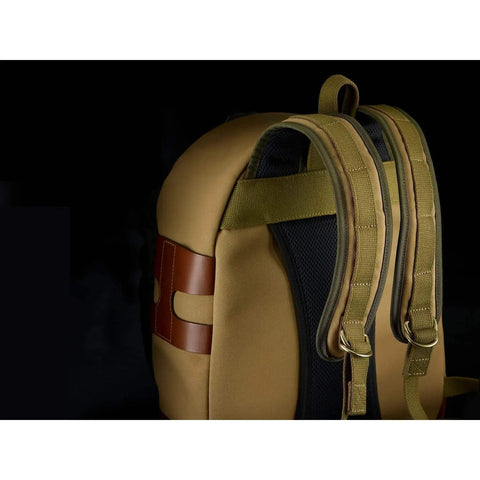 Close-up of Rucksack 25 Camera Bag For DSLR Gear With Tablet Pocket, padded back panel, adjustable straps, and chocolate leather trim.