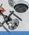 Two Jaws Bearing Puller 8 Inch Adjustable Steel Removal Tool For Auto Gear Work in use on automotive component