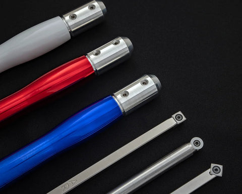 Angled view: set of 3 carbide woodturning tools with colored acrylic handles in gray, red, and blue.
