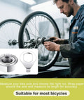 Mechanic using 24 Piece Go To Bike Axle Nuts And Washers Kit M8 M9.5 M10 For Mountain And Road Bikes with wheel close-up