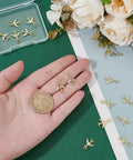 14 Pack Airplane Charms 18K Gold Plated Brass Plane Pendants With Jump Rings on hand showing size and detail