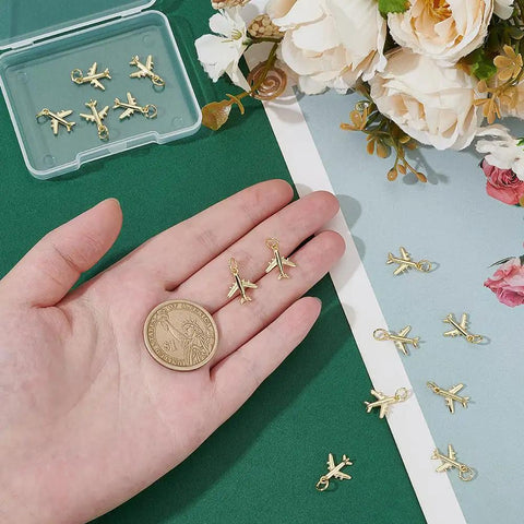 14 Pack Airplane Charms 18K Gold Plated Brass Plane Pendants With Jump Rings on hand showing size and detail