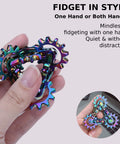 Quiet Metal Infinity Gear Fidget Toy For Focus And Stress Relief held by a hand, rainbow-plated design for discreet use.