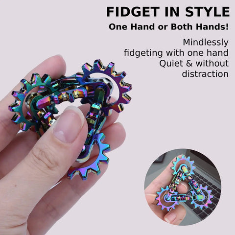 Quiet Metal Infinity Gear Fidget Toy For Focus And Stress Relief held by a hand, rainbow-plated design for discreet use.