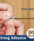 Close-up of hands showing strong adhesive on Clear Vertical Blind Repair Tabs 32 Piece Set No Sweat Diy Fixers For Cracked Slat Replacement.