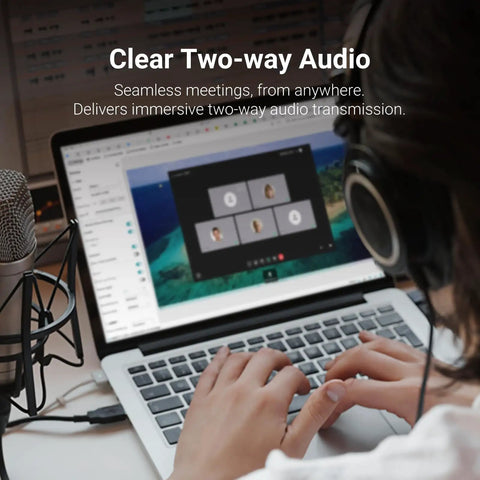 Person using Comet Pro Remote KVM Over WiFi Dual Band WiFi 6 Desktop KVM With 4K At 30 FPS Passthrough on laptop with audio setup