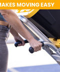 Person using Dual Handle Stair Climbing Hand Truck With 500 Pound Capacity Aluminum Dolly for heavy appliances and furniture.