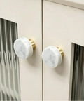 Set Of 6 Real Deal White Marble Cabinet Knobs With Top Shelf Brass Drawer Pulls For Kitchen Drawers And Bathroom Vanities. Close-up view.