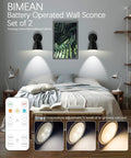 Black Wireless Led Wall Sconces Set Of Two With Remote Control Dimmer And Auto Timer Zero Drilling Hassle Straight Forward Battery Mount, placed in bedroom setting.