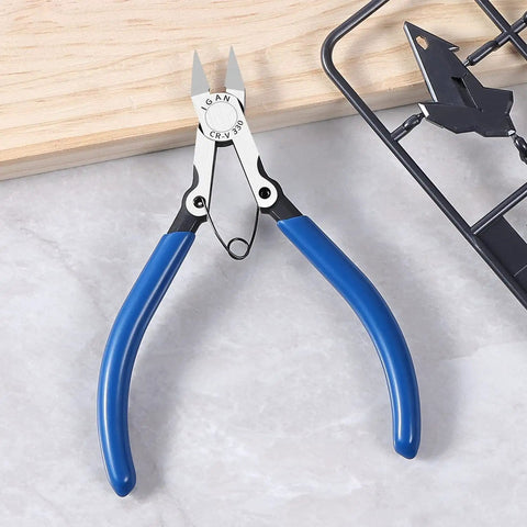 Precision Flush Cutters And Wire Cutters For Electronics And DIY Projects with blue handles on gray surface