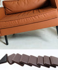 Heavy Duty Furniture Sliders For Carpet And Wood Floors 2 Inch Square Pads under a brown couch, featuring strong adhesive backing for easy gliding.