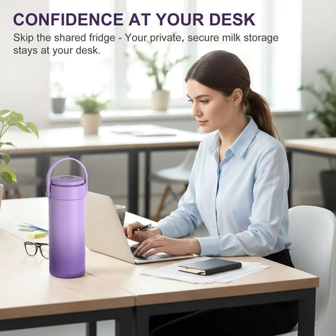 Portable Breast Milk Cooler Bottle With Touch Temp Display And Color Coded Safety Alert For Travel on a desk next to a woman working.