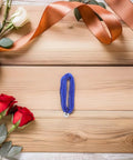 Blue wire from Dual Pack Pro Gear Electric Epee Wire Replacement Set For Fencing on wooden background with roses