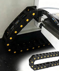 Hella Tough Openable Nylon Cable Drag Chain Slick Flexible Wire Management Carrier For 3D Printers And CNC Routers showing cable routing inside a machine.
