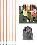 Two children practicing with Six 5Ft Adjustable Agility Poles For Soccer Basketball Football Dog And Horse Training Speed And Agility Gear Sticks