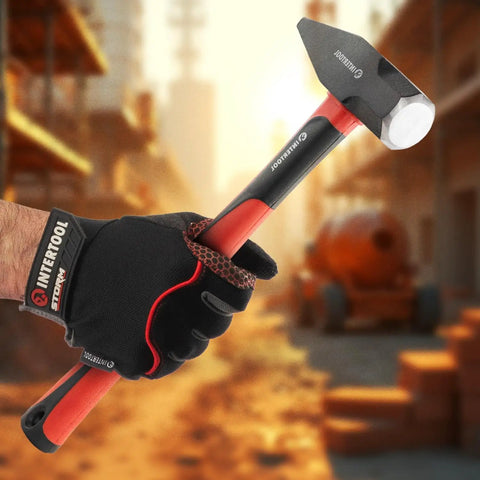 Person holding 40 Oz Blacksmith Hammer For Metalworking And Welding With Shock Absorbing Anti Slip Fiberglass Handle