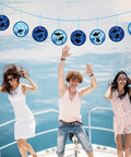 People on boat celebrating with 24 Pack Summer Shark Crafts Kit With Tissue Paper Suncatchers for Ocean Theme DIY Decor