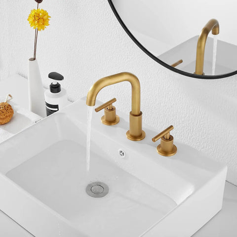 360 Degree Swivel Spout 8 Inch Widespread Two Handle Bathroom Faucet In Antique Brass With Pop Up Drain Deck Mounted Setup Cold And Hot Water Mixing 1.19 GPM Flow installed on a white sink