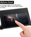 Kick Off Your Desk Upgrade With This Super Solid Black Tv Top Shelf Bracket 2 Pack Monitor Riser Stand For Gaming Setups Gonna Look Dead Legit Today - black cellphone stand with textured surface and phone displaying space image.
