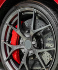 Close-up of alloy wheel with Alloy Wheel Hub Flange Bolts And Nuts Kit For ATV And Go Kart Easy Install Heavy Duty Screws visible.