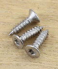 Number 6 X 3/4 Inch Flat Head Torx T15 Self Tapping Screws For Wood And Sheet Metal on wooden surface.