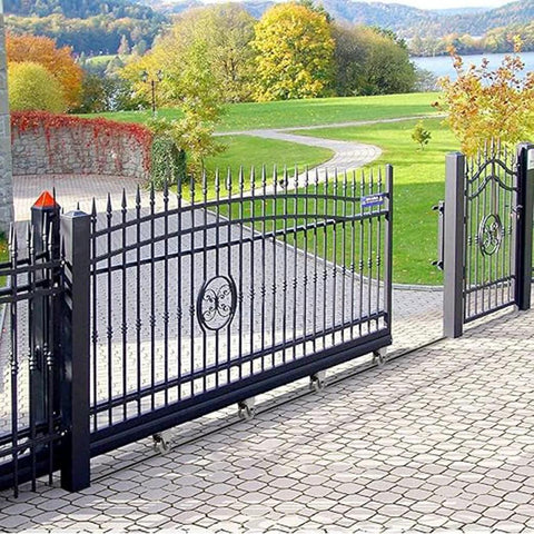 Outdoor sliding gate with 2 Inch V Groove Wheel Heavy Duty Caster Wheel With V Shaped Steel Sliding Gate Roller Bracket in use.