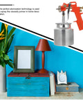 Pro Grade Handheld Paint Sprayer With Precision Flow Control For Cars Tables And Cabinets on a colorful workspace table.