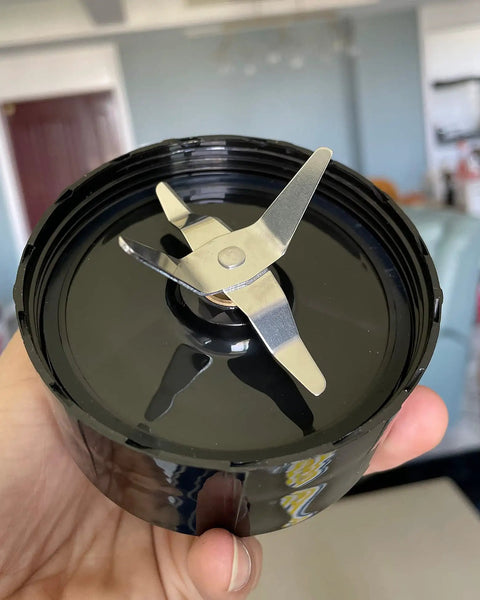 Pack Of 2 Cross Blade Replacement Parts For 250 Watt MB1101 Series Blenders Juicers And Mixers Great For Smoothies And Frozen Drinks Durable Stainless Steel Construction Easy Swap held in hand