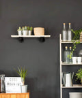 Half Inch Pipe Shelf Bracket Set Of 4 For Wall Mounted Floating Shelves Industrial Rustic Decor Heavy Duty Metal Brackets installed in living room