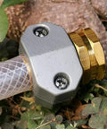 Upgrade Your Yard With This Sick 3set Garden Hose Repair Kit Featuring Super Quick Connectors And Durable Metal Couplings For Easy Spigot Faucet Use That Last All Summer Long. close-up metal hose repair connector on clear garden hose