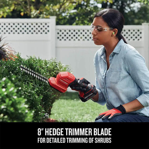 Person using V20 4 Inch Cordless Handheld Grass Trimmer And 8 Inch Mini Hedge Trimmer Kit with Battery for shrub trimming