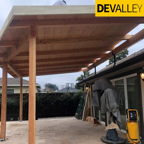 Partially constructed pergola with wooden beams and Roof Riser Brackets Kit For Pergola And Patio Cover Adjustable Angle 4x4 And 4x6