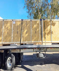 Wooden crates secured on flatbed truck using 20 Pack 4 Inch Edge Protectors For Flatbed Trucks With Mesh Carrying Case