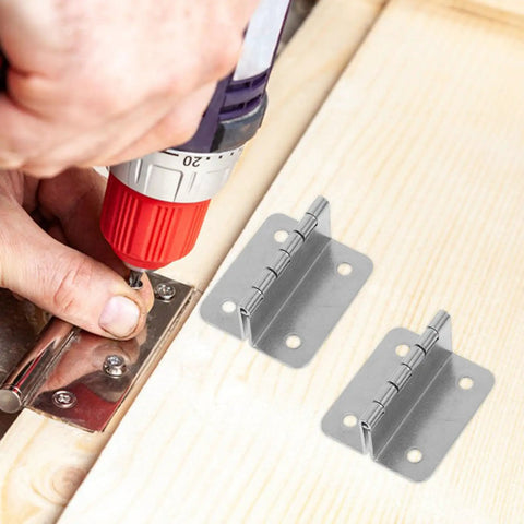 Installing stainless steel butt cabinet hinges with 180 degree fold down capability on a wooden door with a drill.
