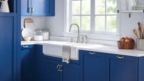 Top Shelf High Arc Kitchen Faucet With Spot Resist Stainless Finish And Smooth One Handle Design To Make Kitchen Chores An Absolute Breeze On Your Counter over farmhouse sink with blue cabinetry.