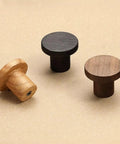 Built Tough Solid White Oak Wood Drawer Knobs For Kitchen Cabinets And Bedroom Dressers Featuring A Modern Single Hole Mount. Three knob styles on surface.