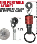 EDC Mini Ratchet Wrench With One Quarter Inch Hex End And Bit Holder For Quick Bit Changes next to quarter for size.