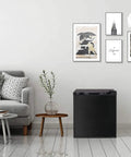 Straight Up Chilling 1.1 Cubic Foot Upright Mini Freezer With Reversible Single Door and Dial In Temp Settings in a cozy living room setting.
