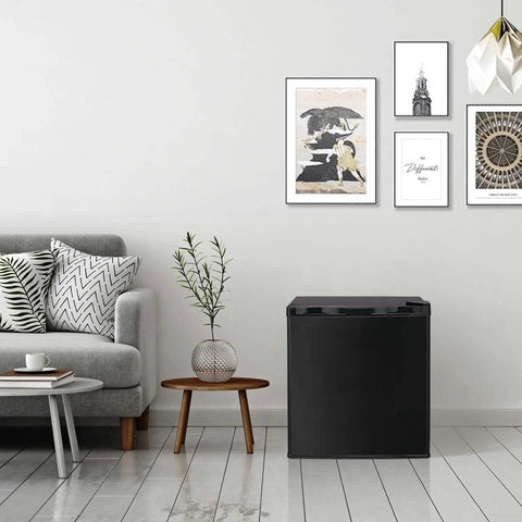 Straight Up Chilling 1.1 Cubic Foot Upright Mini Freezer With Reversible Single Door and Dial In Temp Settings in a cozy living room setting.