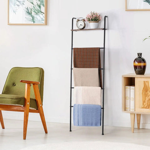 Versatile Blanket And Towel Ladder With Shelf Wall Leaning Black Iron Rack For Living Room Or Bathroom Cozy Space Saver Home Decor Rustproof Finish For Easy Access In Laundry Or Bath Organization, displaying throws and decor.