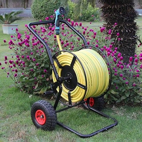 Totally Rock Solid Heavy Duty Garden Hose Reel Cart With Smooth Rolling Wheels Low Center Base Stays Put Outdoors, with yellow hose.
