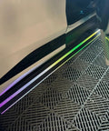 Slick Electric Deployable Running Boards For Tesla Cybertruck, illuminated side steps showing smooth design and automatic functionality.